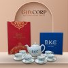 Bộ ấm chén quà tặng in logo màu trắng Bát Tràng họa tiết sen xanh vàng kim